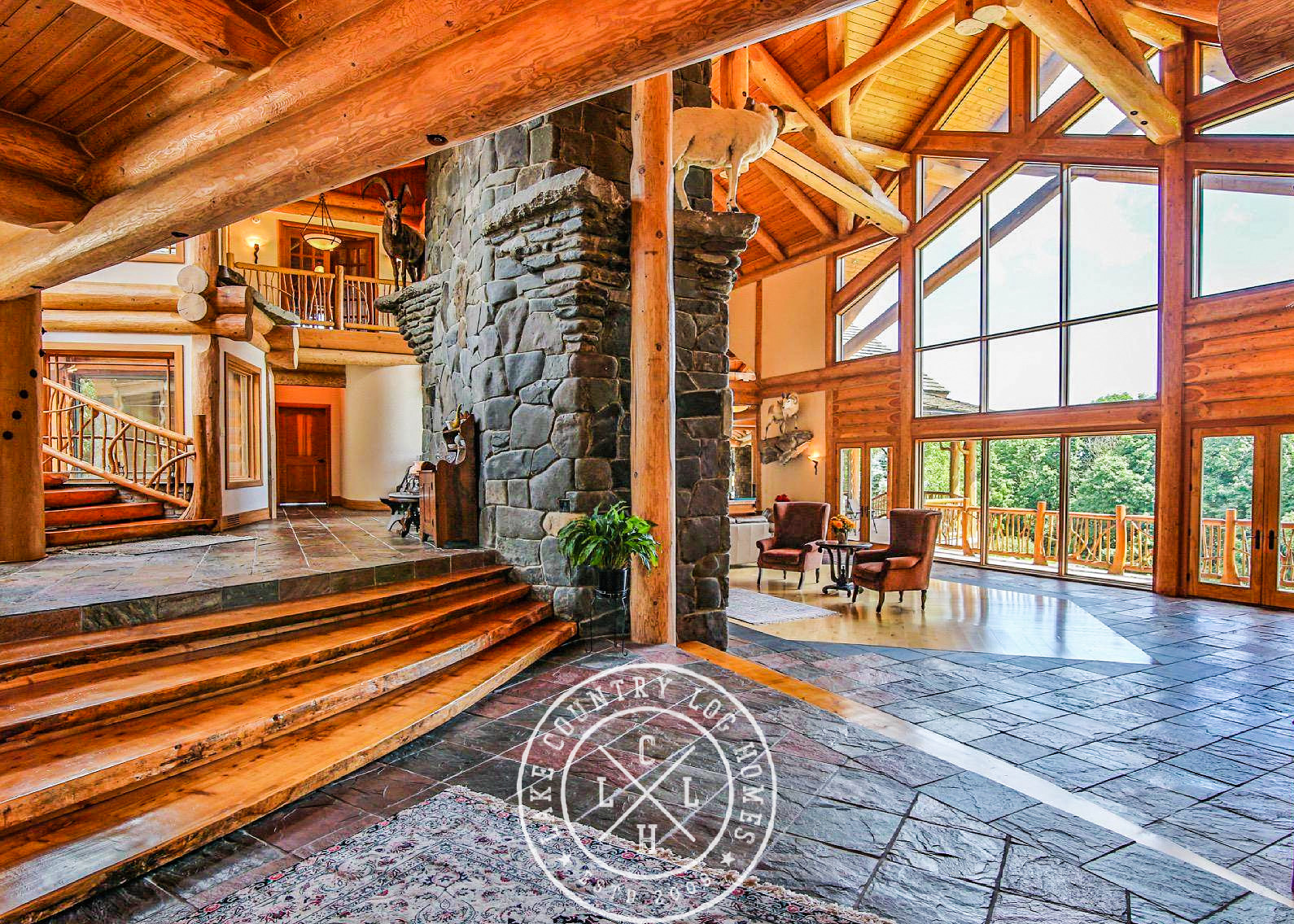 Expansive Great Room glazing framed by handcrafted Douglas Fir posts and beams